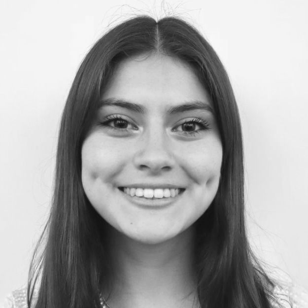 A black and white headshot of a young woman with long hair
